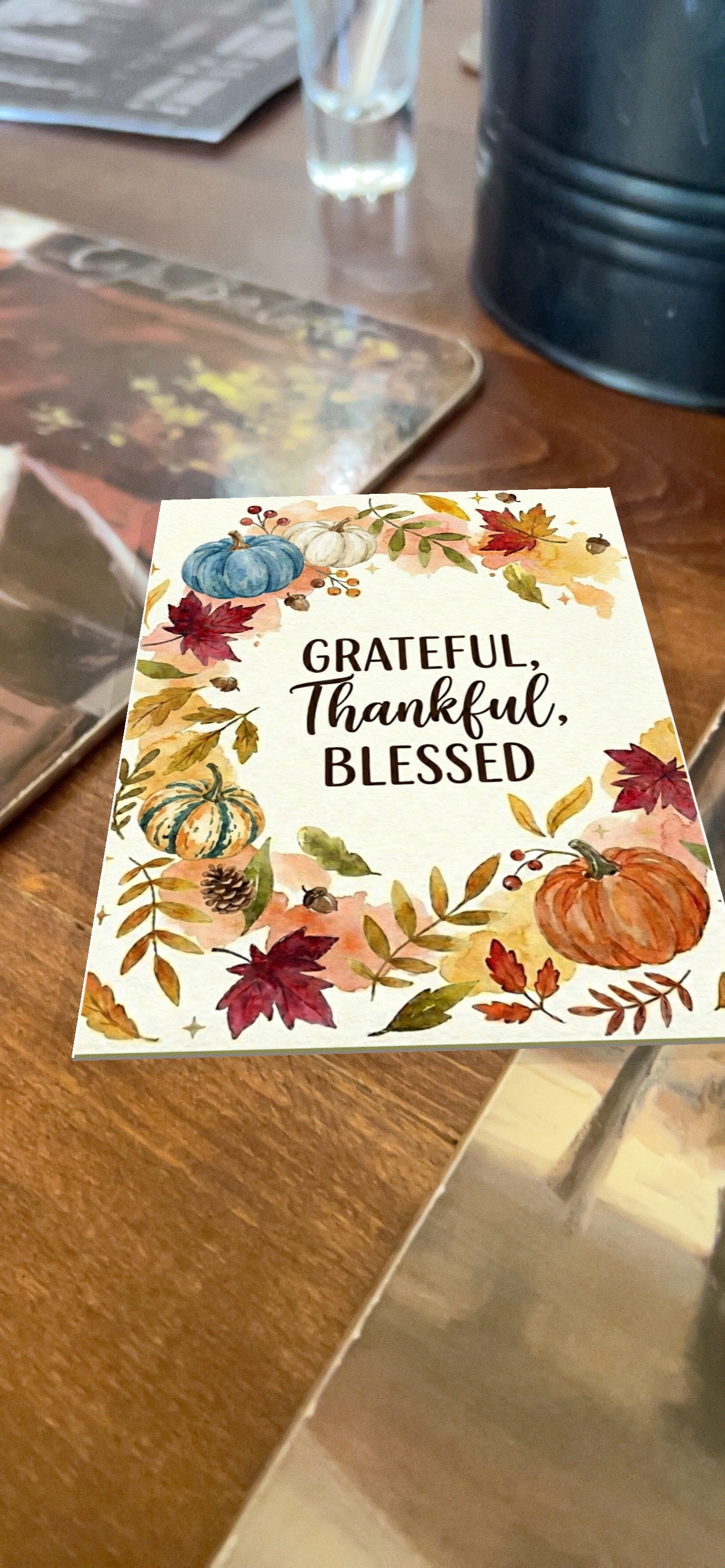 An iGreet card placed on a real wooden table